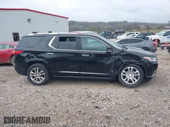 2021 Chevrolet Traverse High Country z VIN 1GNEVNKW4MJ165059, wystawiony jako IAAI lot #41887403 z przebiegiem 92 519 mil mil oraz . Historia ofert i sprzedaży dostępna na DreamBid. Obrazek 13.