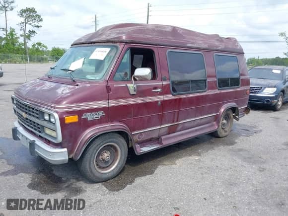 1994 Chevrolet Chevy Van with VIN 1GBEG25K4RF177057, listed as a IAAI auction lot 42090808 with 123,654 mi miles and . Bid and sale history available at DreamBid. Image 2.