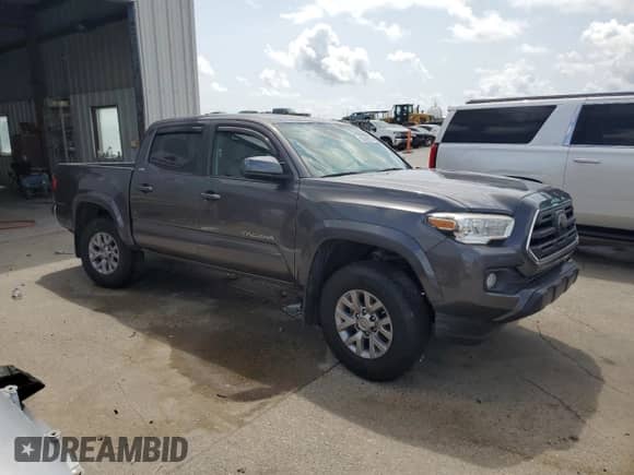 2019 Toyota Tacoma TRD Sport with VIN 5TFAZ5CN4KX078788, listed as a Copart auction lot 59543625 with 66,302 mi miles and Salvage title. Bid and sale history available at DreamBid. Image 4.