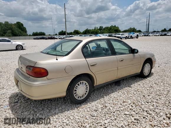 2004 Chevrolet Malibu Classic with VIN 1G1ND52F24M574700, listed as a Copart auction lot 63038945 with 86,576 mi miles and Salvage title. Bid and sale history available at DreamBid. Image 3.