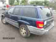 2002 Jeep Grand Cherokee Sport with VIN 1J4GW38S42C166263, listed as a IAAI auction lot 42521707 with 267,842 mi miles and . Bid and sale history available at DreamBid. Image 3.