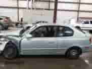 2005 Hyundai Accent GLS z VIN KMHCG35C15U336300, wystawiony jako IAAI lot #42522063 z przebiegiem Nie podano mil oraz . Historia ofert i sprzedaży dostępna na DreamBid. Obrazek 14.