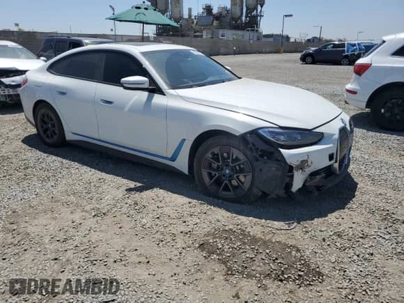 2022 BMW i4 eDrive40 with VIN WBY73AW04NFN12057, listed as a Copart auction lot 67297925 with 69,670 mi miles and Salvage title. Bid and sale history available at DreamBid. Image 4.