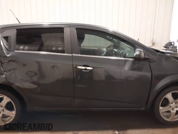 2014 Chevrolet Sonic LTZ with VIN 1G1JE6SB2E4130099, listed as a IAAI auction lot 41568613 with 133,572 mi miles and . Bid and sale history available at DreamBid. Image 13.