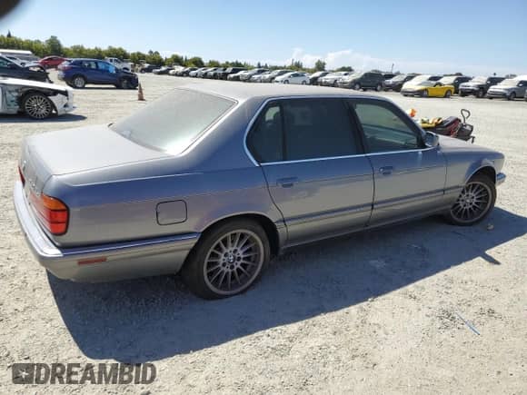 1994 BMW 7 Series with VIN WBAGD8324RDE90687, listed as a Copart auction lot 66664445 with 220,975 mi miles and Clean title. Bid and sale history available at DreamBid. Image 3.