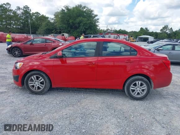 2012 Chevrolet Sonic LS with VIN 1G1JB5SH0C4224924, listed as a IAAI auction lot 42498765 with 99,466 mi miles and . Bid and sale history available at DreamBid. Image 14.