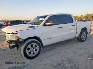 2023 Ram 1500 Lone Star with VIN 1C6SRFFT1PN692860, listed as a Copart auction lot 86466385 with 57,407 mi miles and Salvage title. Bid and sale history available at DreamBid. Image 1.