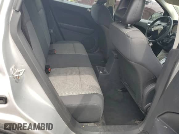 2009 Dodge Caliber SXT z VIN 1B3HB48A69D164622, wystawiony jako Copart lot #67573855 z przebiegiem Nie podano mil oraz Szkoda całkowita • Salvage title. Historia ofert i sprzedaży dostępna na DreamBid. Obrazek 10.