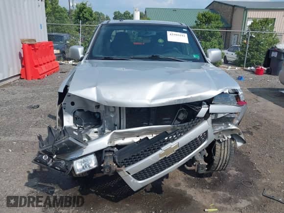 2011 Chevrolet Colorado 1LT z VIN 1GCHTCFEXB8131732, wystawiony jako IAAI lot #42595193 z przebiegiem 129 689 mil mil oraz . Historia ofert i sprzedaży dostępna na DreamBid. Obrazek 13.