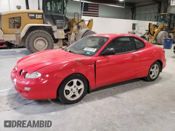 2001 Hyundai Tiburon с VIN KMHJG25F01U226912, выставлен на аукционе Copart как лот 89357135 с пробегом 131 487 миль миль и Чистый • Clean title. История ставок и продаж доступна на DreamBid. Изображение 1.