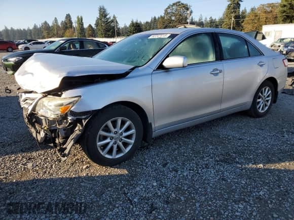 2011 Toyota Camry LE with VIN 4T1BK3EKXBU128008, listed as a Copart auction lot 82247415 with 180,539 mi miles and Clean title. Bid and sale history available at DreamBid. Image 1.