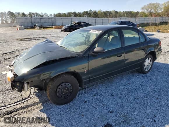 2002 Saturn SL with VIN 1G8ZG54842Z165557, listed as a Copart auction lot 50699145 with Not provided miles and Salvage title. Bid and sale history available at DreamBid. Image 1.