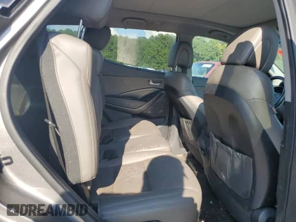 2017 Hyundai Santa Fe 2.4L z VIN 5NMZU3LB6HH038970, wystawiony jako Copart lot #69933835 z przebiegiem 174 618 mil mil oraz Szkoda całkowita • Salvage title. Historia ofert i sprzedaży dostępna na DreamBid. Obrazek 11.