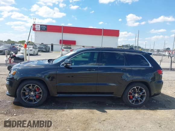 2015 Jeep Grand Cherokee SRT with VIN 1C4RJFDJ4FC853745, listed as a IAAI auction lot 43327828 with 68,614 mi miles and . Bid and sale history available at DreamBid. Image 14.