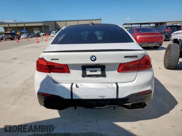 2018 BMW 5 Series M550i xDrive with VIN WBAJB9C54JB034746, listed as a Copart auction lot 71218435 with 128,279 mi miles and Clean title. Bid and sale history available at DreamBid. Image 6.