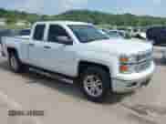 2014 Chevrolet Silverado 1500 LT with VIN 1GCVKREC5EZ412652, listed as a IAAI auction lot 42420856 with 165,891 mi miles and . Bid and sale history available at DreamBid. Image 1.