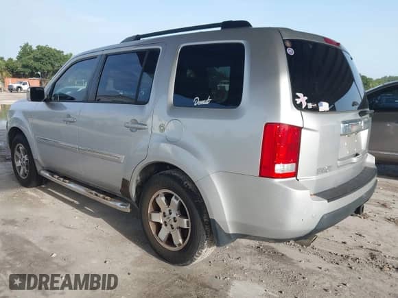 2009 Honda Pilot Touring with VIN 5FNYF38839B022943, listed as a IAAI auction lot 42443006 with 199,184 mi miles and . Bid and sale history available at DreamBid. Image 3.
