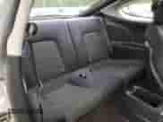 2005 Hyundai Tiburon GS z VIN KMHHM65D35U182780, wystawiony jako Copart lot #58958295 z przebiegiem 186 652 mil mil oraz Czysty tytuł • Clean title. Historia ofert i sprzedaży dostępna na DreamBid. Obrazek 10.
