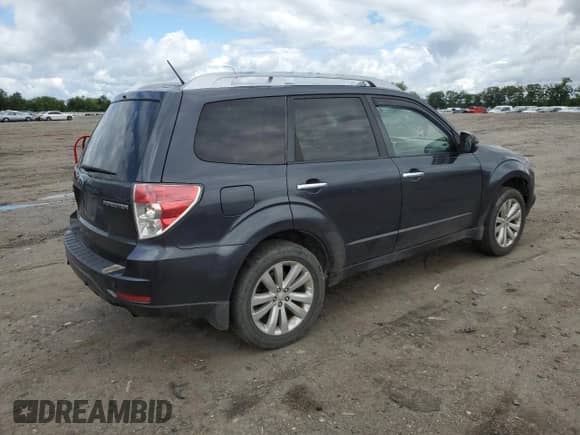 2011 Subaru Forester z VIN JF2SHBHC7BH719649, wystawiony jako Copart lot #57782065 z przebiegiem 241 157 mil mil oraz Szkoda całkowita • Salvage title. Historia ofert i sprzedaży dostępna na DreamBid. Obrazek 3.