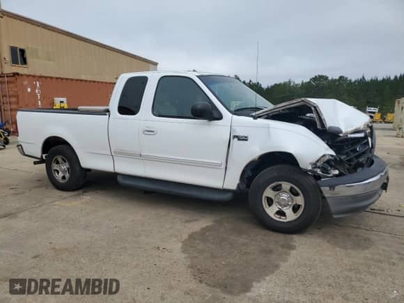 2003 Ford F-150 XL with VIN 1FTRX17213NB44096, listed as a Copart auction lot 85324585 with 247,714 mi miles and Salvage title. Bid and sale history available at DreamBid. Image 4.