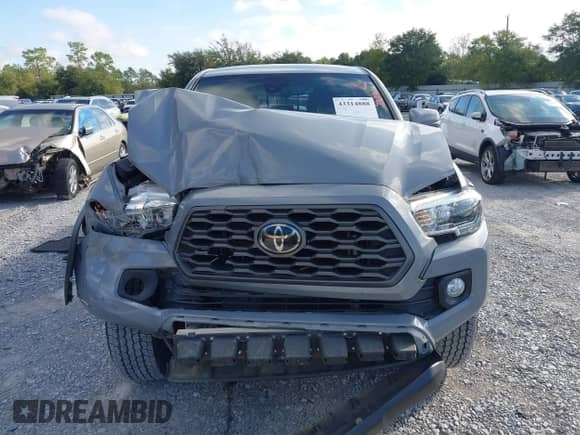 2021 Toyota Tacoma SR with VIN 3TYCZ5ANXMT024937, listed as a IAAI auction lot 43314888 with 77,580 mi miles and . Bid and sale history available at DreamBid. Image 12.
