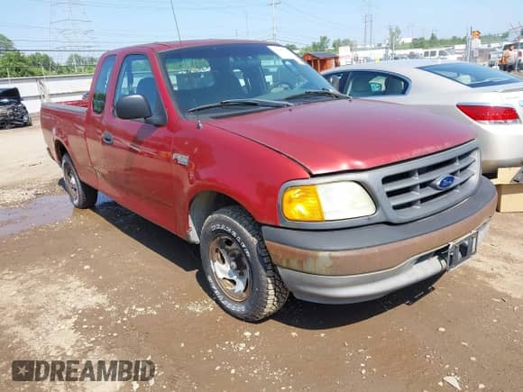 2004 Ford F-150 XL with VIN 2FTRX17204CA57555, listed as a IAAI auction lot 42807013 with Not provided miles and . Bid and sale history available at DreamBid. Image 1.