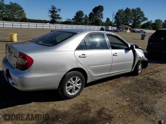 2004 Toyota Camry XLE z VIN 4T1BF30K44U063865, wystawiony jako Copart lot #70030615 z przebiegiem 74 669 mil mil oraz Szkoda całkowita • Salvage title. Historia ofert i sprzedaży dostępna na DreamBid. Obrazek 3.