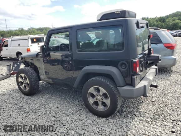 2017 Jeep Wrangler Sport with VIN 1C4AJWAG1HL580790, listed as a Copart auction lot 62061765 with 135,592 mi miles and Salvage title. Bid and sale history available at DreamBid. Image 2.