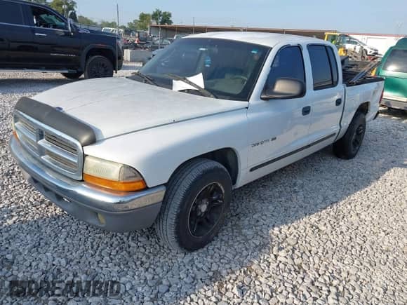 2001 Dodge Dakota Sport with VIN 1B7HL2AN61S297510, listed as a IAAI auction lot 43232339 with 216,879 mi miles and . Bid and sale history available at DreamBid. Image 2.
