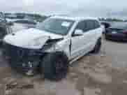 2014 Jeep Grand Cherokee SRT-8 z VIN 1C4RJFDJ4EC242189, wystawiony jako IAAI lot #42485088 z przebiegiem 172 527 mil mil oraz . Historia ofert i sprzedaży dostępna na DreamBid. Obrazek 2.