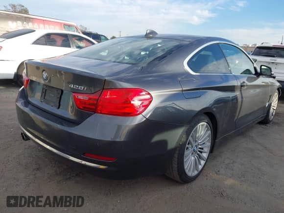 2014 BMW 4 Series 428i with VIN WBA3N7C5XEF719384, listed as a IAAI auction lot 41694678 with 115,517 mi miles and . Bid and sale history available at DreamBid. Image 4.