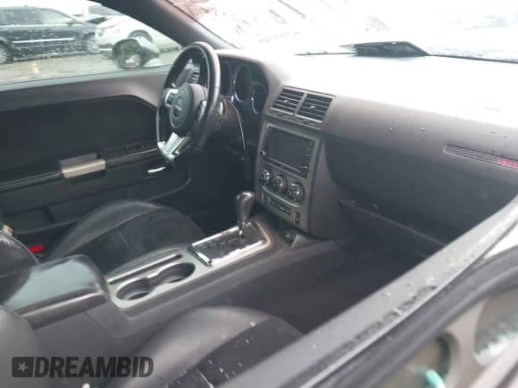 2012 Dodge Challenger SRT-8 392 with VIN 2C3CDYCJ5CH122880, listed as a IAAI auction lot 42165109 with 103,973 mi miles and . Bid and sale history available at DreamBid. Image 5.