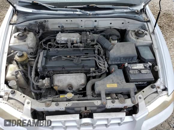 2002 Hyundai Accent GL z VIN KMHCG45C12U398748, wystawiony jako Copart lot #82077055 z przebiegiem 175 456 mil mil oraz Czysty tytuł • Clean title. Historia ofert i sprzedaży dostępna na DreamBid. Obrazek 11.