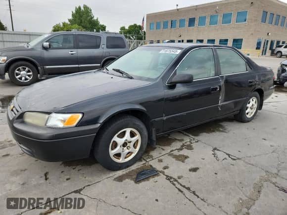 1997 Toyota Camry LE with VIN 4T1BG22KXVU821763, listed as a Copart auction lot 71875345 with 205,057 mi miles and Salvage title. Bid and sale history available at DreamBid. Image 1.