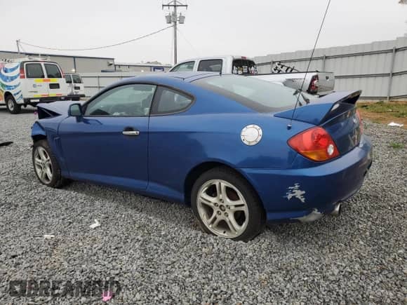 2004 Hyundai Tiburon GT with VIN KMHHN65F04U116166, listed as a Copart auction lot 51525065 with 153,035 mi miles and Salvage title. Bid and sale history available at DreamBid. Image 2.