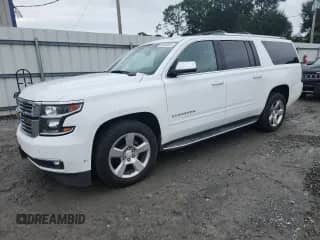 2017 Chevrolet Suburban Premier with VIN 1GNSKJKC0HR148602, listed as a Copart auction lot 68928615 with 129,235 mi miles and Salvage title. Bid and sale history available at DreamBid. Image 1.