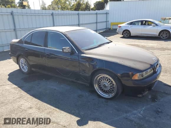 2003 BMW 5 Series 530i with VIN WBADT53463CE94338, listed as a Copart auction lot 66219965 with 202,481 mi miles and Salvage title. Bid and sale history available at DreamBid. Image 4.