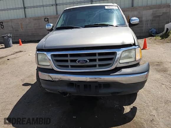 2002 Ford F-150 XLT с VIN 1FTRW07L42KC25065, выставлен на аукционе Copart как лот 70672075 с пробегом 249 564 миль миль и Списание • Salvage title. История ставок и продаж доступна на DreamBid. Изображение 14.