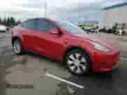 2023 Tesla Model Y Long Range z VIN 7SAYGDEE8PA113314, wystawiony jako Copart lot #80321355 z przebiegiem 15 710 mil mil oraz Szkoda całkowita • Salvage title. Historia ofert i sprzedaży dostępna na DreamBid. Obrazek 4.
