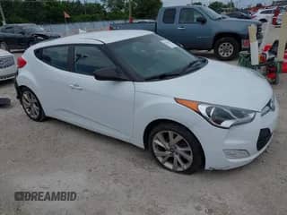 2017 Hyundai Veloster z VIN KMHTC6AD5HU306667, wystawiony jako IAAI lot #42615053 z przebiegiem 125 529 mil mil oraz . Historia ofert i sprzedaży dostępna na DreamBid. Obrazek 1.