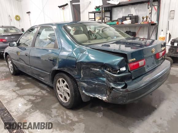 1997 Toyota Camry LE z VIN 4T1BF22K5VU903726, wystawiony jako IAAI lot #41552016 z przebiegiem 121 079 mil mil oraz . Historia ofert i sprzedaży dostępna na DreamBid. Obrazek 6.