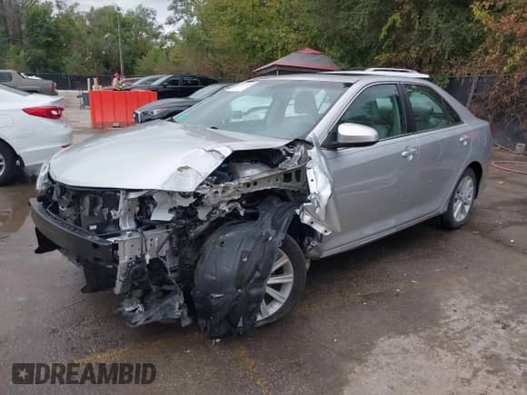 2013 Toyota Camry LE z VIN 4T1BD1FK2DU069763, wystawiony jako IAAI lot #43414989 z przebiegiem 70 738 mil mil oraz . Historia ofert i sprzedaży dostępna na DreamBid. Obrazek 2.