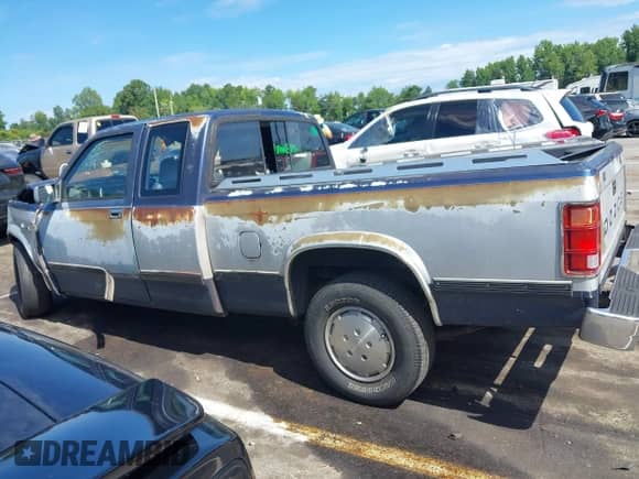 1990 Dodge Dakota z VIN 1B7FL23X0LS641390, wystawiony jako IAAI lot #42826429 z przebiegiem 186 919 mil mil oraz . Historia ofert i sprzedaży dostępna na DreamBid. Obrazek 14.