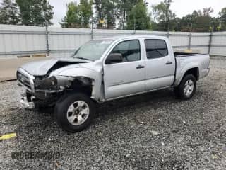 2009 Toyota Tacoma PreRunner z VIN 3TMJU62N69M091273, wystawiony jako Copart lot #70086405 z przebiegiem 144 325 mil mil oraz Szkoda całkowita • Salvage title. Historia ofert i sprzedaży dostępna na DreamBid. Obrazek 1.