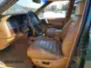 1998 Jeep Grand Cherokee with VIN 1J4FX48S8WC281615, listed as a Copart auction lot 77305594 with 128,393 mi miles and Salvage title. Bid and sale history available at DreamBid. Image 7.