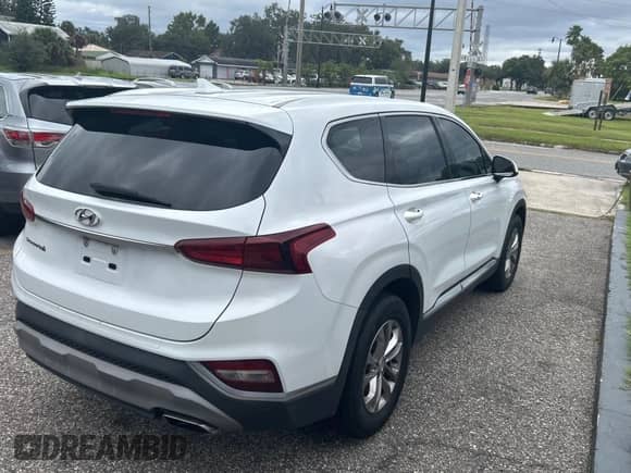 2019 Hyundai Santa Fe SEL с VIN 5NMS33AD0KH053559, выставлен на аукционе Copart как лот 84977185 с пробегом 129 077 миль миль и Чистый • Clean title. История ставок и продаж доступна на DreamBid. Изображение 4.