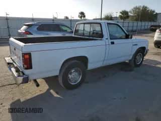 1992 Dodge Dakota z VIN 1B7FL26XXNS690465, wystawiony jako Copart lot #77436274 z przebiegiem 112 226 mil mil oraz Czysty tytuł • Clean title. Historia ofert i sprzedaży dostępna na DreamBid. Obrazek 3.