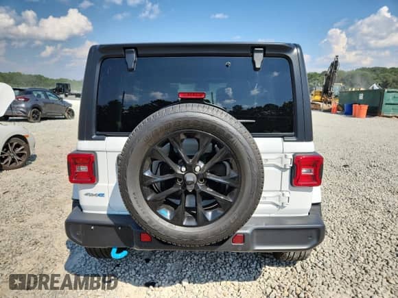 2022 Jeep Wrangler Unlimited Sahara with VIN 1C4JJXP65NW276425, listed as a Copart auction lot 70727595 with 29,165 mi miles and Salvage title. Bid and sale history available at DreamBid. Image 6.