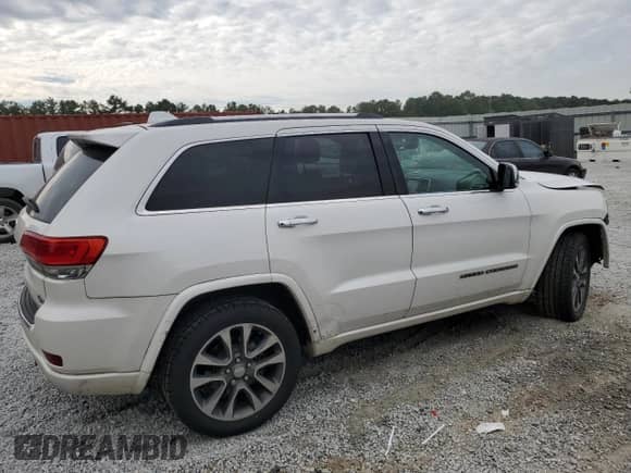 2017 Jeep Grand Cherokee Overland with VIN 1C4RJECG1HC773855, listed as a Copart auction lot 70180755 with 123,525 mi miles and Salvage title. Bid and sale history available at DreamBid. Image 3.