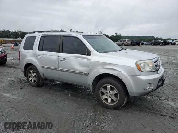 2009 Honda Pilot Touring with VIN 5FNYF38839B027611, listed as a Copart auction lot 67812505 with 148,357 mi miles and Salvage title. Bid and sale history available at DreamBid. Image 4.